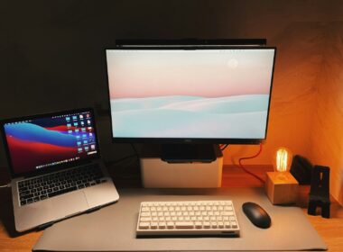 a desk with a laptop and a computer monitor